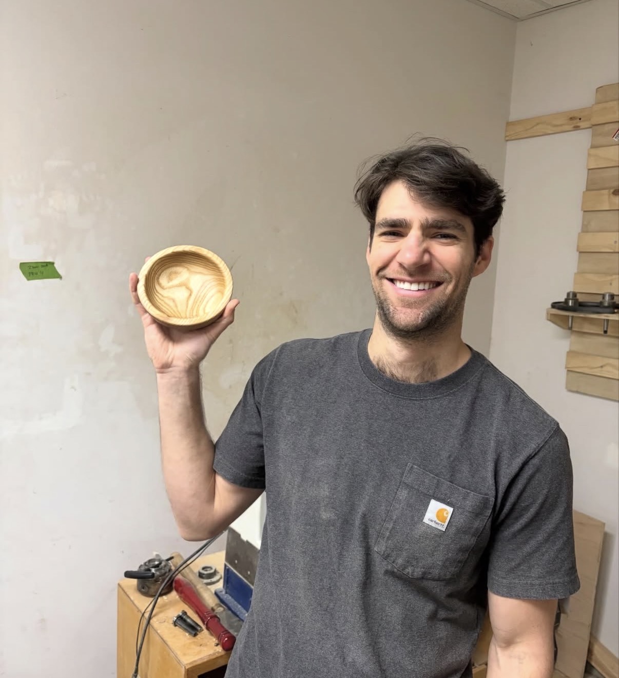 A student showing off the bowl they turned in a class at MakerSpace Charlotte